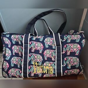 21" duffle tote with "Victoria" embroidered on the front
